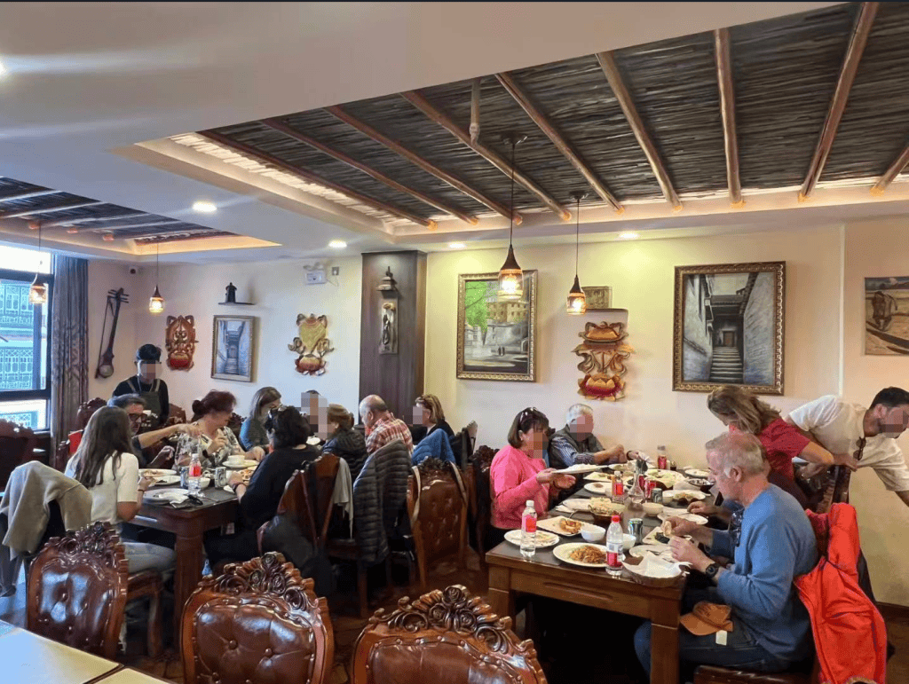 Tibetan cuisine served during the travelers Tibet journey, showing local dishes and table setting